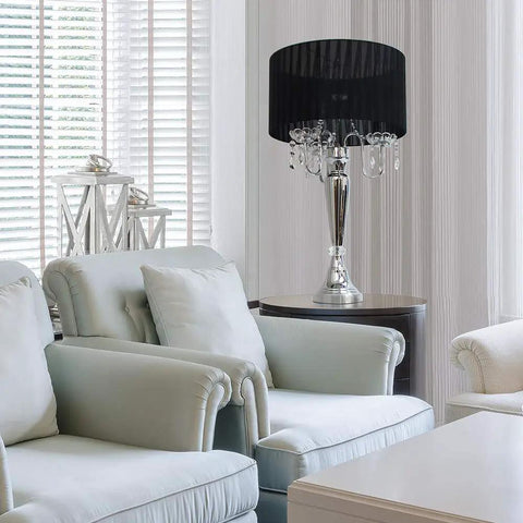 Trendy Romantic Sheer Shade Hanging Crystals Table Lamp In Black With Chrome Finish on side table in living room
