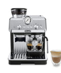 Killer Home Barista Setup Featuring Precision Conical Burr Grinder And Auto Milk Frother For Slick Bean To Cup Espresso and Cappuccinos. Silver espresso machine with coffee grounds.