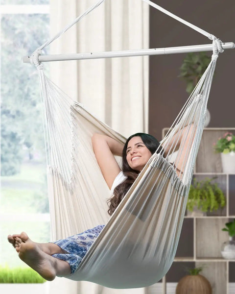Woman relaxing in XXL Hammock Chair For Big Folks With Generous 70.9 By 47.2 Inches, 500 Lb Capacity, Heavy Duty Steel Spreader Bar indoors