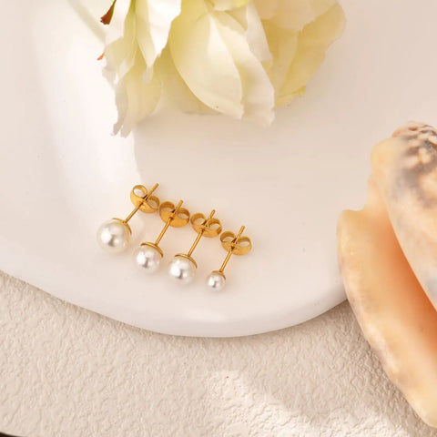 Five Piece Pearl Stud Earrings Set With Gold Finish Ball Studs From 4mm To 8mm For Women And Men, Classic Gold Pearl Earrings For Everyday Wear, Dope For Multiple Piercings And Modern Day Style. Gold pearl stud earrings set on white surface