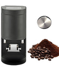 Total Game Changer Electric 58Mm Espresso Tamper Featuring Stainless Steel Build And Programmable Touchscreen Controls For Shots That Always Hit Different next to coffee grounds and beans.