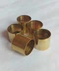 Five Premium Rock Solid Brass Ferrules for snug fit on wood walking sticks, showcasing a shiny metallic finish.