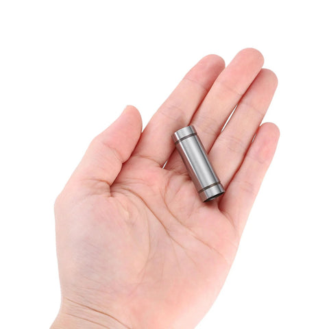 LM6LUU steel linear bearing, 6mm bore, 12mm OD, 35mm length, held in hand