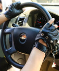 Mens Black Steampunk Fingerless Gloves Premium PU Leather Half Finger Biker Gear driving a car steering wheel.