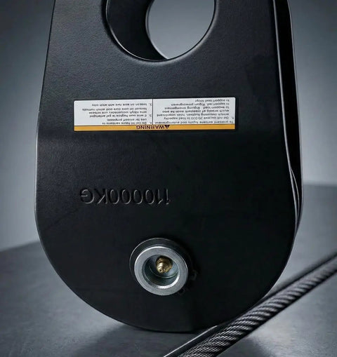 Beefy 10 Ton Winch Snatch Block Pulley Heavy Duty 22,000 Pound Capacity For Off Road Recovery With Steel Cable And Synthetic Rope Ready Jeep Ford Toyota Compatible, black finish with visible warning label and cable.
