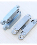 Concealed Cabinet Door Hinge Set For Cupboards, Dope Soft-Close Hardware in silver for kitchen cabinets visible on wooden surface