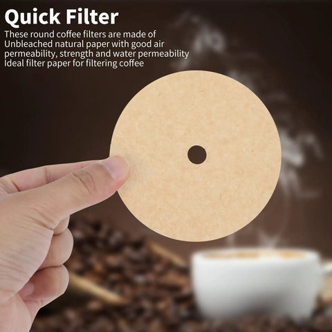 Hand holding Unbleached 3.75 Inch Percolator Coffee Filter Disc against blurred coffee beans and cup backdrop