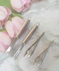 4 Pack Pineapple Eye Peeler And Cutter Kit Stainless Steel V Shape Eye Remover on marble with pink flowers