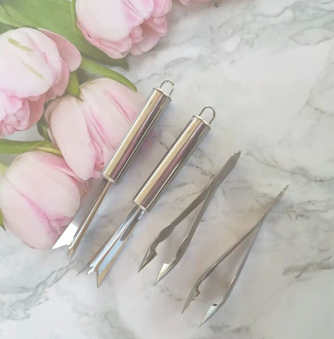 4 Pack Pineapple Eye Peeler And Cutter Kit Stainless Steel V Shape Eye Remover on marble with pink flowers