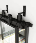Close-up of the Double Bypass Glass Barn Door Kit With 10 Ft Hardware And Soft Close, showing black carbon steel frame and clear glass.