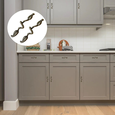 Leaf Shape Drawer Pull Handle Set In Vintage Bronze Finish installed on gray kitchen cabinets, showcasing twig branch design.
