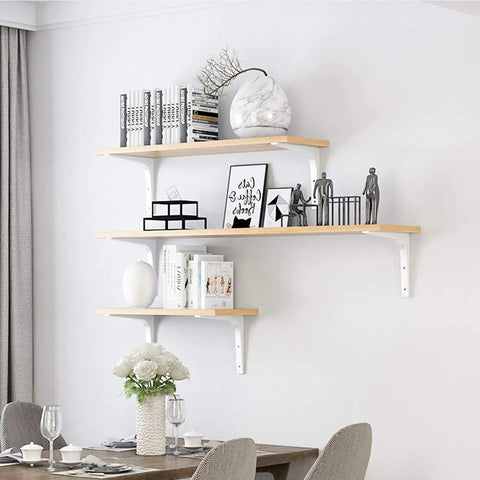 Built Like A Tank Heavy Duty Steel Shelf Brackets With Rock Solid Holding Power For Your Floating Shelves And Wall Corner Displays, No Sweat Setup, Dope White Finish, 75Mm Size, 2 Pack Kit mounted with wooden shelves and decor.