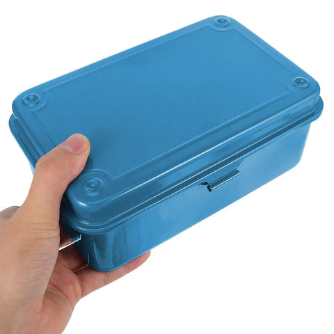 Hand holding a blue Kickass Vintage Iron Tool Box With Secure Locking Lid And Snappy Quick Access Compartments For Home Mechanic And Car Garage Heavy Duty Metal Storage Solution.