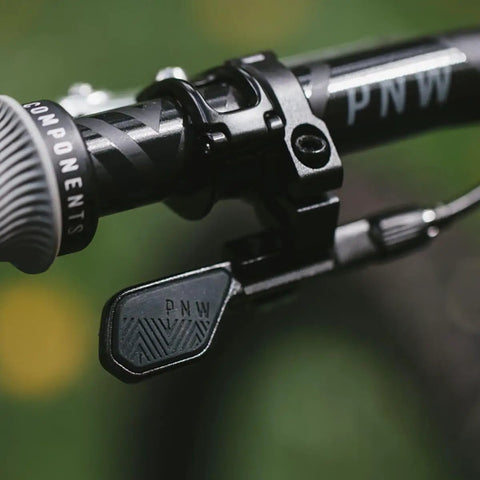 Range Dropper Lever For MTB 22.2mm Clamp, SRAM MatchMaker X Compatible, Black, featuring silicone thumb pad on handlebar