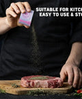 Manual Spice Grinder With No Fuss Quiet Grind, Calm Precision Die Cast Zinc Alloy, Pink and Blue Gradient being used on steak