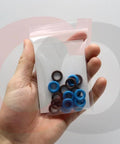 Hand holding Fuel Injector O Ring Seal Kit 217-1588 Replacement For GM Vehicles, clear bag showing 16 blue and brown seals