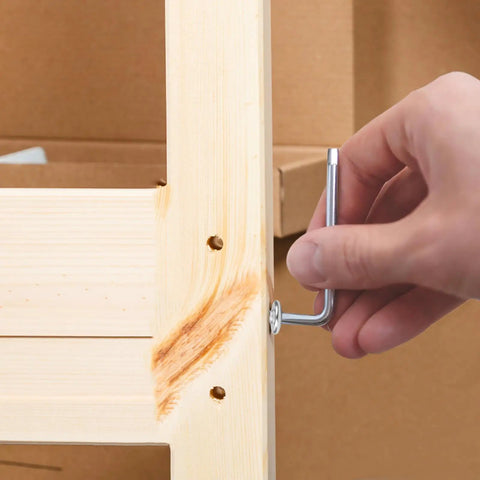 Using Allen wrench with Top Shelf Boss Level Flat Head Hex Socket Sheet Metal Screws 100 Piece Set M4 on wooden furniture assembly.