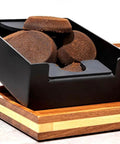 Hella Durable Premium Sapele Wood Espresso Tamper Station Featuring A Slick Built In Slide For Your 58mm Portafilter And A Killer Coffee Bar Accessory Organizer You Love, showing grounds in detachable cup.