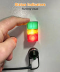 Person pressing dual head push button with signal lamp for industrial control panels and automation systems on console