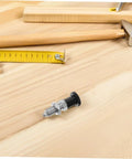 Built Tough Indexing Plunger Pin With Dead Tight Spring Loaded Threaded Design In Premium Stainless Steel for quick fix jobs on a wooden surface.