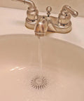 White Two Pack Bathroom Sink Hair Catcher With Heavy Duty Suction Cup For Pop Up Drains And One Inch Stopper in use with water flowing.