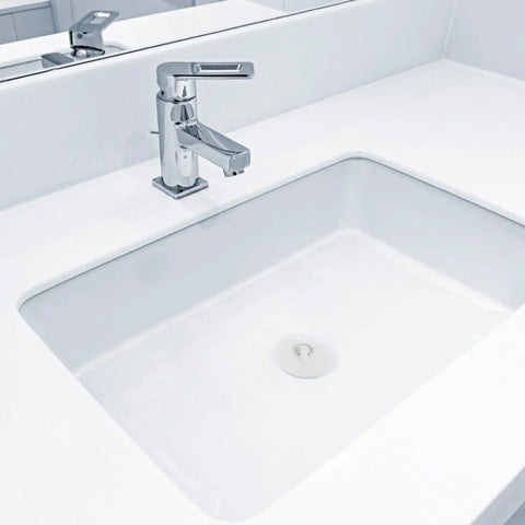 4pcs Rubber Bathtub Drain Stopper with Pull Ring in a modern white sink, showcasing single lever faucet and smooth surface.