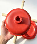 Rock Solid Heavy Duty Rubber Cup Toilet Plunger With Reinforced Wooden Handle, red rubber cup held in hand.