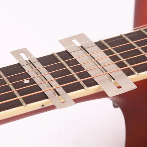 Guitar Luthier Tool Set With Fret Crowning File Radius Gauges Feeler on guitar fretboard with fingerboard guards in use.