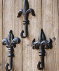 Top Shelf Single Piece Heavy Duty Cast Iron Wall Hook With Screws Vintage Coat Hanger Organizer For Scarves Bags Towels Keys Cap Rustproof Badass Home Decor Accessory on wooden background.