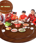 Heavy Duty Hardwood Lazy Susan Turntable Featuring Slick Spin Mechanics Zero Sweat Setup used at a dining table with family.
