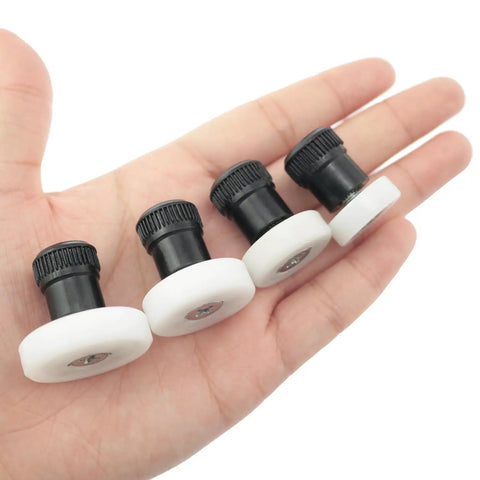 Set Of 4 Ceramic Clay Polishing Tools For Sculpture And Trimming Wheels held in a hand, showcasing compact and easy grip design.