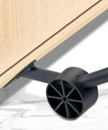 Heavy Duty Furniture Sliders And Appliance Moving Wheels With Reinforced Metal Build And Dual Ball Bearings on smooth surface.