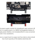 Dope Two Pack Breadboard Power Supply Module With USB C Charging 3.3V And 5V Rails Type A Output Rechargeable Battery Stand Perfect For Arduino Prototyping And Quick DIY Projects, showing module and battery slot.