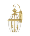 Monterey Two Light Outdoor Wall Lantern in Polished Brass Finish with clear beveled glass, classic design, side view
