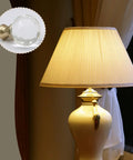 Sleek Clear Crystal Lamp Finials Two Pack With Polished Gold Screw Bases Solid Pick For Floor And Table Lamps To Quick Boost Your Home Decor Game Today mounted on a lamp.