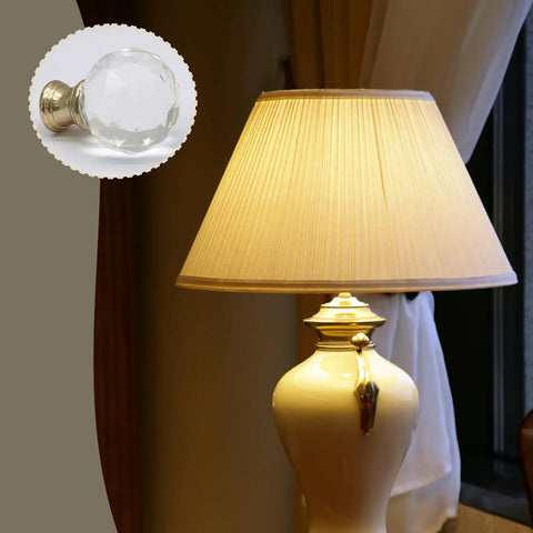 Sleek Clear Crystal Lamp Finials Two Pack With Polished Gold Screw Bases Solid Pick For Floor And Table Lamps To Quick Boost Your Home Decor Game Today mounted on a lamp.
