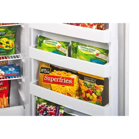 Hella Roomy White Upright Freezer With 16.7 Cubic Feet Of Storage showing organized shelves of frozen vegetables and fries.