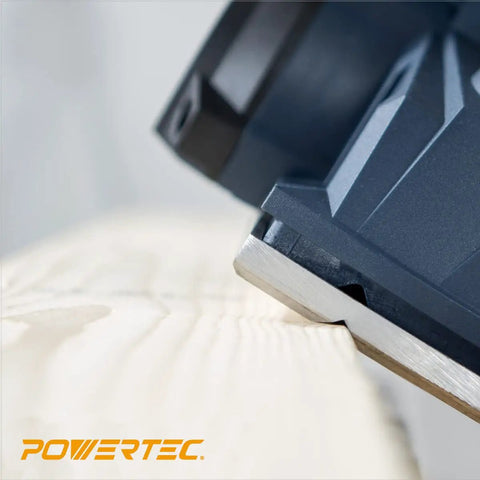 Top Shelf Carbide Handheld Planer Blades 4-3/8 Inch on wood surface, showcasing smooth cutting edge for precision woodworking.