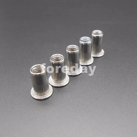 Badass M5 Rivet Insert Clinch Nuts Premium 304 Stainless Steel Flat Head Knurled Blind Hardware Locking Fasteners 20 Piece Pack displayed in a row.