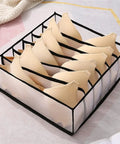Slick Nylon Mesh Drawer Divider Set For Bras Socks And Lingerie Dresser Sorting Bins holding beige bras organized in stylish mesh bins.