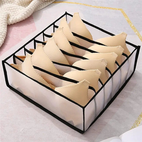 Slick Nylon Mesh Drawer Divider Set For Bras Socks And Lingerie Dresser Sorting Bins holding beige bras organized in stylish mesh bins.
