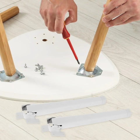 Installing the Four Piece Folding Table Leg Set In White Plastic on a surface, showing adjustment and ease of installation.