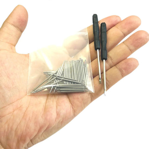 Hand holding 50Pcs 18mm Watch Spring Bars Replacement Kit With 1.5mm Diameter Stainless Steel Pins Double Flanged Ends and tools