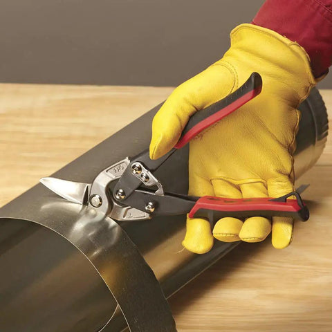 Left Cut Aviation Snips With Red Grips Power Fit Ergonomic Grips 18 Gauge Capacity cutting sheet metal on wooden table