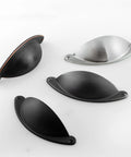 Various styles of 2.5 inch cup pulls, including oil rubbed bronze drawer pulls, shown in different finishes and angles.