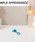 Blue Silicone Bathtub Plug Stopper for 1 Inch Drains on a table next to a baby bottle and plush toy.