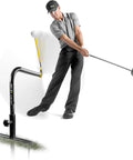 Golfer using Pure Path Golf Swing Trainer Yellow Large for Immediate Swing Path Feedback, setup upright for driver practice.