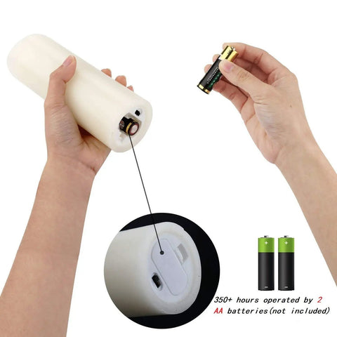Person inserting battery into Flameless Votive Pillar Candles Set Of 7 With Remote, Ivory LED Candles With Timer And Batteries Included