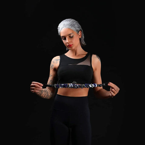 Person holding a Resistance Bands Accessories Kit With Exercise Band Handles And Home Gym Bar, highlighting the versatile pro grade fitness attachment.