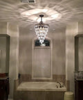 Crystal Chandelier in Farmhouse Bronze, 4 Light Hanging Pendant Fixture illuminating a bathroom, 14-inch diameter, rustic glam